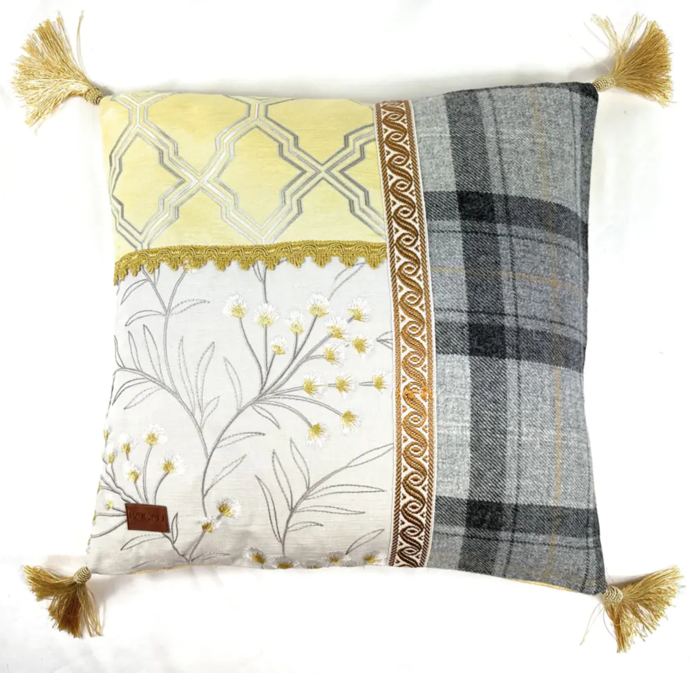 Cushion with yellow tassels